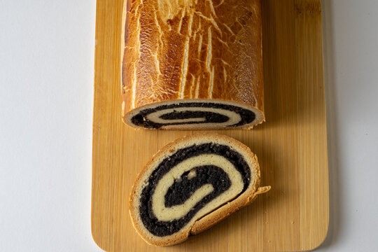Traditional Hungarian Poppy Seed Bejgli on Bamboo Board