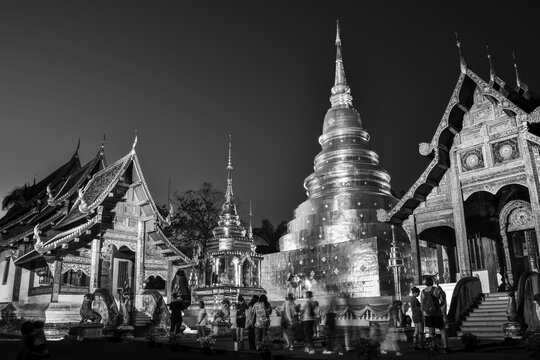 Chiang Mai, Thailand - 15th february, 2024: visitors explore Wat Phra Sing - Buddhist temple .Tha Luang Road in Tambon Wiang, Mueang district, Chiang Rai northern Thailand. Background banner monochrome