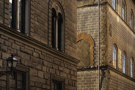 Historic buildings with detailed brick fa&ccedil;ade in warm evening light, old town, Florence, Tuscany, Italy