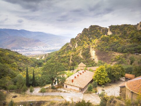 Aerial view down to buildings of orthodox monastery Shio-Mgvime. Georgia
