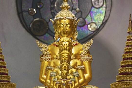 The Buddhas nestled within one another symbolise the inner journey, the continuity of the teachings and the infinite radiance of the Dharma, Main Chedi (Phra That), Wat Phra That Sorn Kaew Buddhist temple complex, Khao Kho Mountains, Phetchabun Province, Isan, Thailand