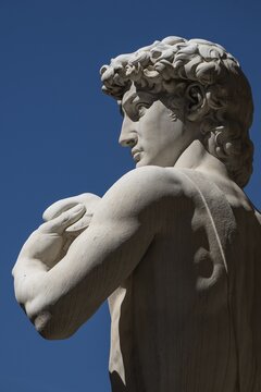 Detail, marble statue David by Michelangelo in front of Palazzo Vecchio, Piazza della Signoria, Florence, Tuscany, Italy