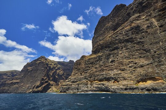 Los Gigantes, high rocks with distinctive cliffs under a cloudy sky over the sea, whale watching boat tour, whale watching, dolphins, west coast, Tenerife, Canary Islands, Spain