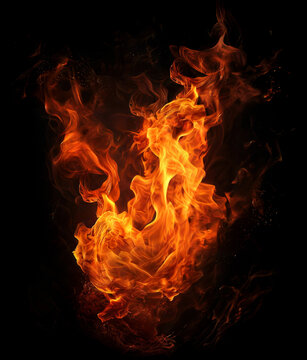 Intense abstract orange and yellow fire swirls and eddies forming an organic shape with glowing particles and smoke on black background creating powerful movement.