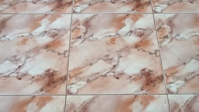 Marble pattern ceramic floor tiles in soft beige, white, and brown tones with polished finish, highlighting smooth texture, elegant surface, and versatile home renovation style