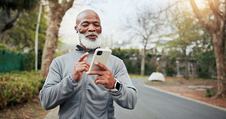 Obraz premium Fitness, phone and senior man with music outdoor for wellness playlist, podcast and smile. Mobile, happy runner and black person with earphones for exercise audio, space and active retirement