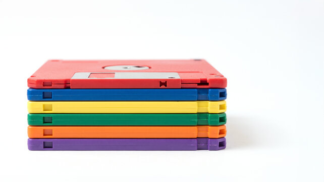 Floppy disk stack colorful retro technology data storage media isolated white background