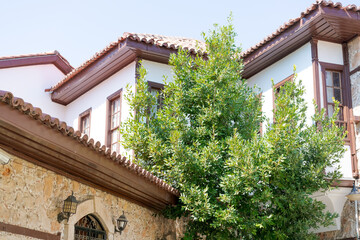 Fototapeta premium Corner of Ottoman White House with Terracotta Roof Tiles at Kaleici