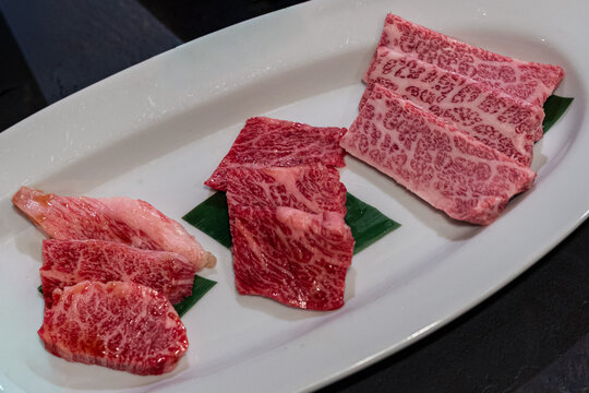 Premium Hida Wagyu Beef Assortment with Three Different Cuts on White Plate