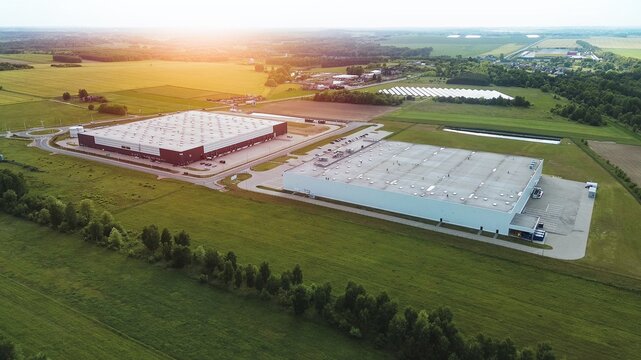 Modern storage facility with yellow walls and trucks