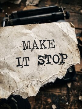detailed Macro photo of make it stop typewriter text showing abstract micro structural details and textures with professional studio lighting