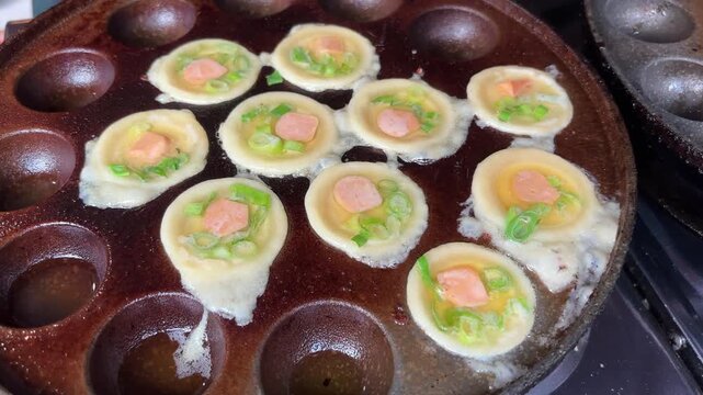 Mini Pancakes with Sausage and Green Onion Cooking in Special Mould Pan.