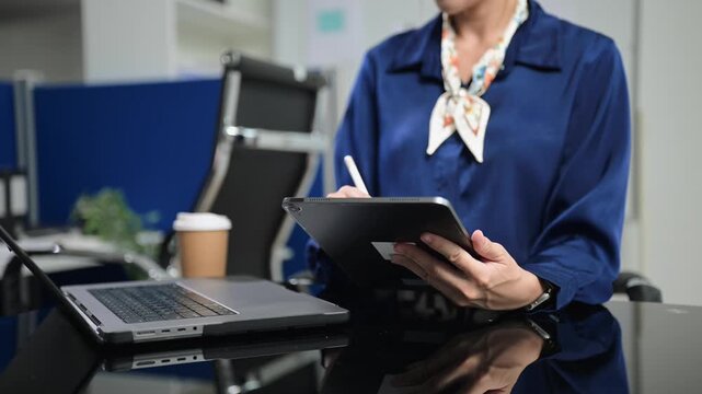 Women counting coins on calculator taking from the piggy bank. hand holding pen working on calculator to calculate on desk about cost at office.