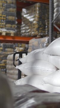 Raw goods in industrial warehouse - sugar inside a large storage