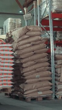 Red loaders transport pallet with boxes on industrial warehouse