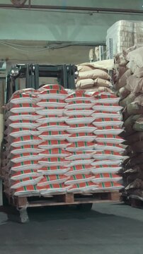 Loaders moves boxes on industrial warehouse
