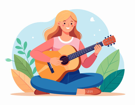 Happy young woman playing acoustic guitar while sitting outdoors among green leaves