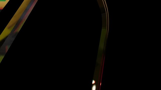 Abstract golden yellow light streaks and glowing curves isolated on a solid black background design