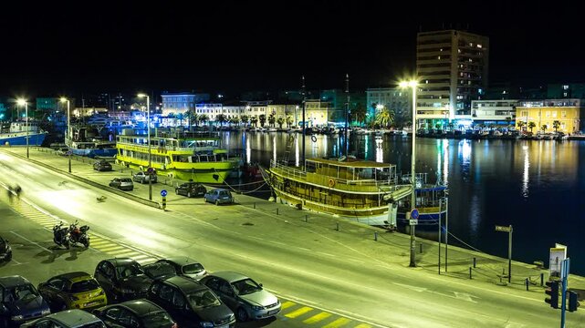 Night timelapse of Zadar waterfront and harbor in Croatia featuring illuminated marina and Adriatic coast