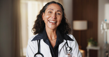 Obraz premium Doctor, laugh and woman in hospital for healthcare, wellness service and career experience in clinic. Portrait, mature female person and medical professional, funny physician and general practitioner