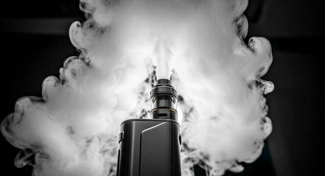 Black electronic cigarette mod emitting thick white vapor clouds. Close up of a modern vaporizer device with an atomizer in action. Conceptual image for vaping culture and nicotine alternative.