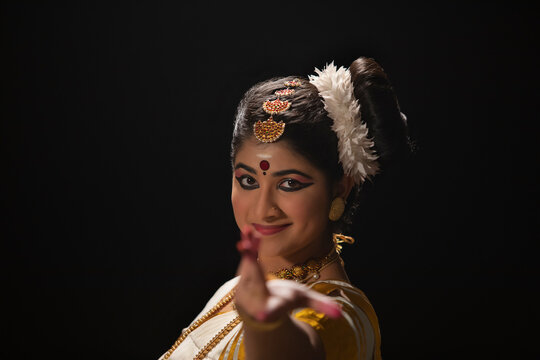 Portrait of a beautiful Mohiniattam dancer in Ardhachandra mudra