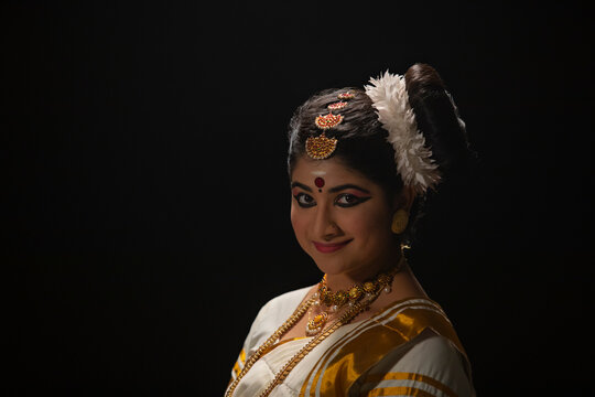 Portrait of a beautiful Mohiniattam dancer in Ardhachandra mudra