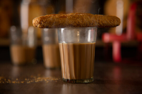 Fan kept on a glass filled with tea on a table