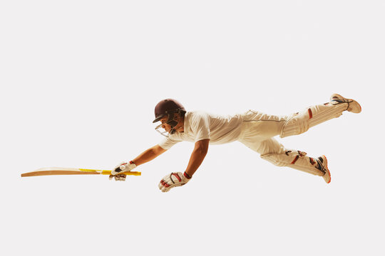 Cricketer,batsman leaping towards the crease during a run