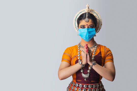 Odissi dancer wearing a mask