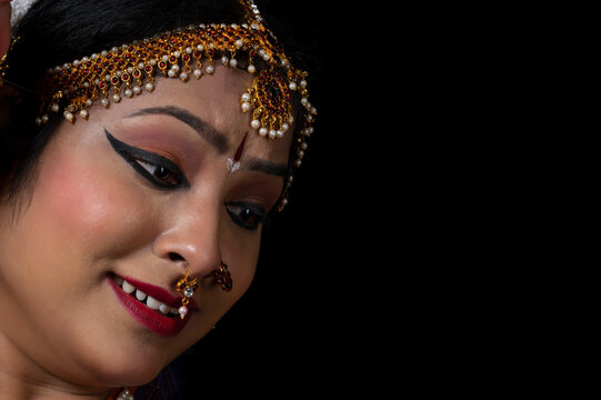 Kuchipudi dancer showing Karuna rasa in her dance
