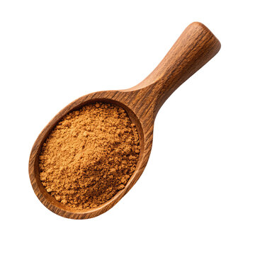 Ground pumpkin spice powder in wooden scoop spoon brown seasoning baking ingredient