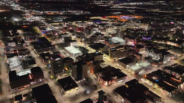 drone footage showcasing the Nebraska State Capitol in Lincoln, Nebraska, with panoramic views of the landmark tower, the famous The Sower statue, downtown skyline, and the surrounding urban landscape