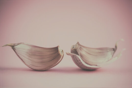 Close-up of two garlic cloves on a table
