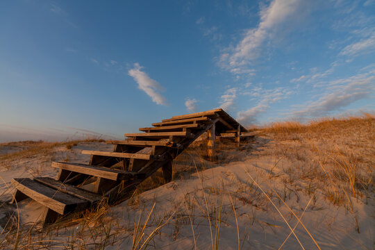 Wooden stairs and walkway across the sand dunes at dusk, Klaipeda, Lithuania