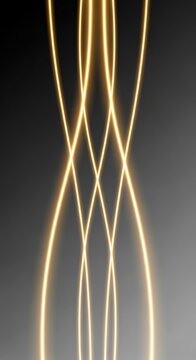 Abstract Golden Light Streaks Flowing and Intersecting on Dark Background.