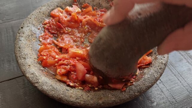 Making Fresh Indonesian Sambal Tomato Using Stone Mortar and Pestle