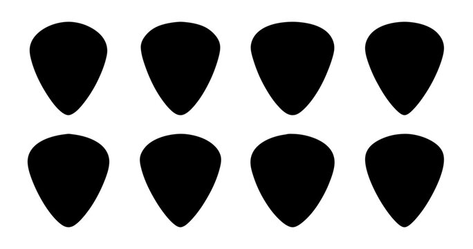 Black guitar picks in organized rows - Two rows of sleek black guitar picks neatly aligned for display or sale, ideal for music-related stock imagery.