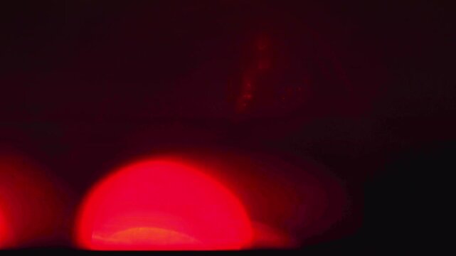 4K blurred red flashing emergency lights strobing in the dark for fire rescue or police