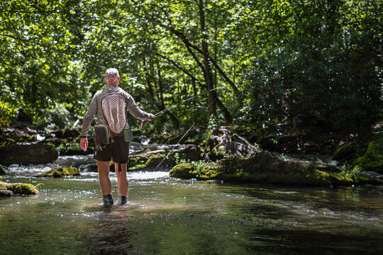 A man fly fishes with a Euro nymph rod