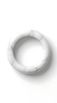 White marble ring sculpture on white background