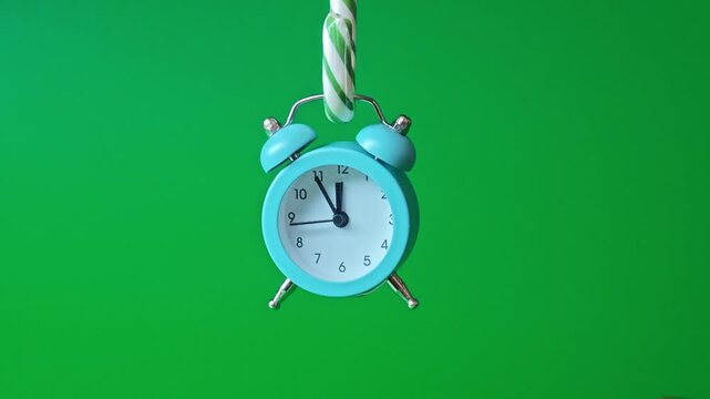 Clock shows time with different angles on a green background