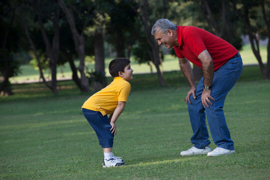 Grandfather and grandson enjoying in a park