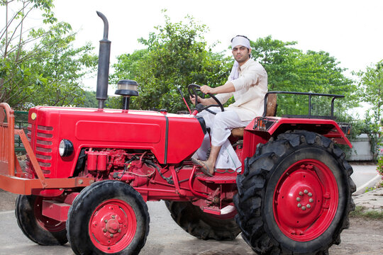 Portrait of a farmer sitting on a tractor
