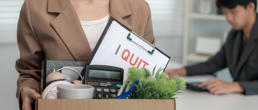 Stressful business women will resign from the company. female keep equipment for work and personal items on paper box. resignation, job placement and vacancies concept.