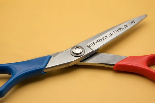 Scissors inscribed with international left-handers day left handed left hander