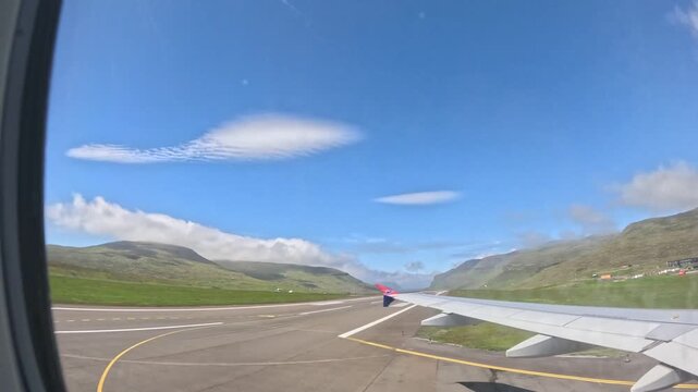 VAGAR, FAROE ISLANDS - JULY 1, 2024: Atlantic Airways airplane taxiing on Vagar Airport runway in Faroe Islands