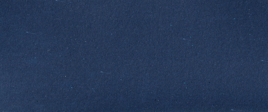 empty textured pattern background design for craft projects  - Abstract organic dark blue handmade paper cardboard craft paper texture with recycled inclusions, subtle fiber and small colorful flecks