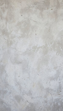 Rough Concrete Wall Texture: A close-up view of a weathered, textured concrete wall, showcasing its subtle imperfections and raw, industrial aesthetic.