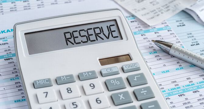A calculator with the word Reserve on the display